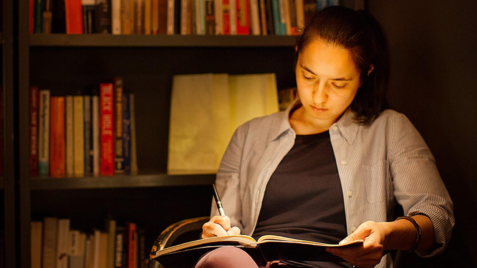 Female student reading a book