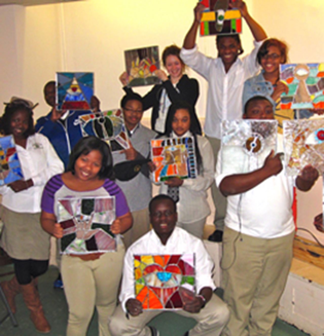 Students from Germantown High School display their stained glass windows