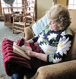 Megan Peaslee's "Acute Reader" book stand helps aging people read without pain