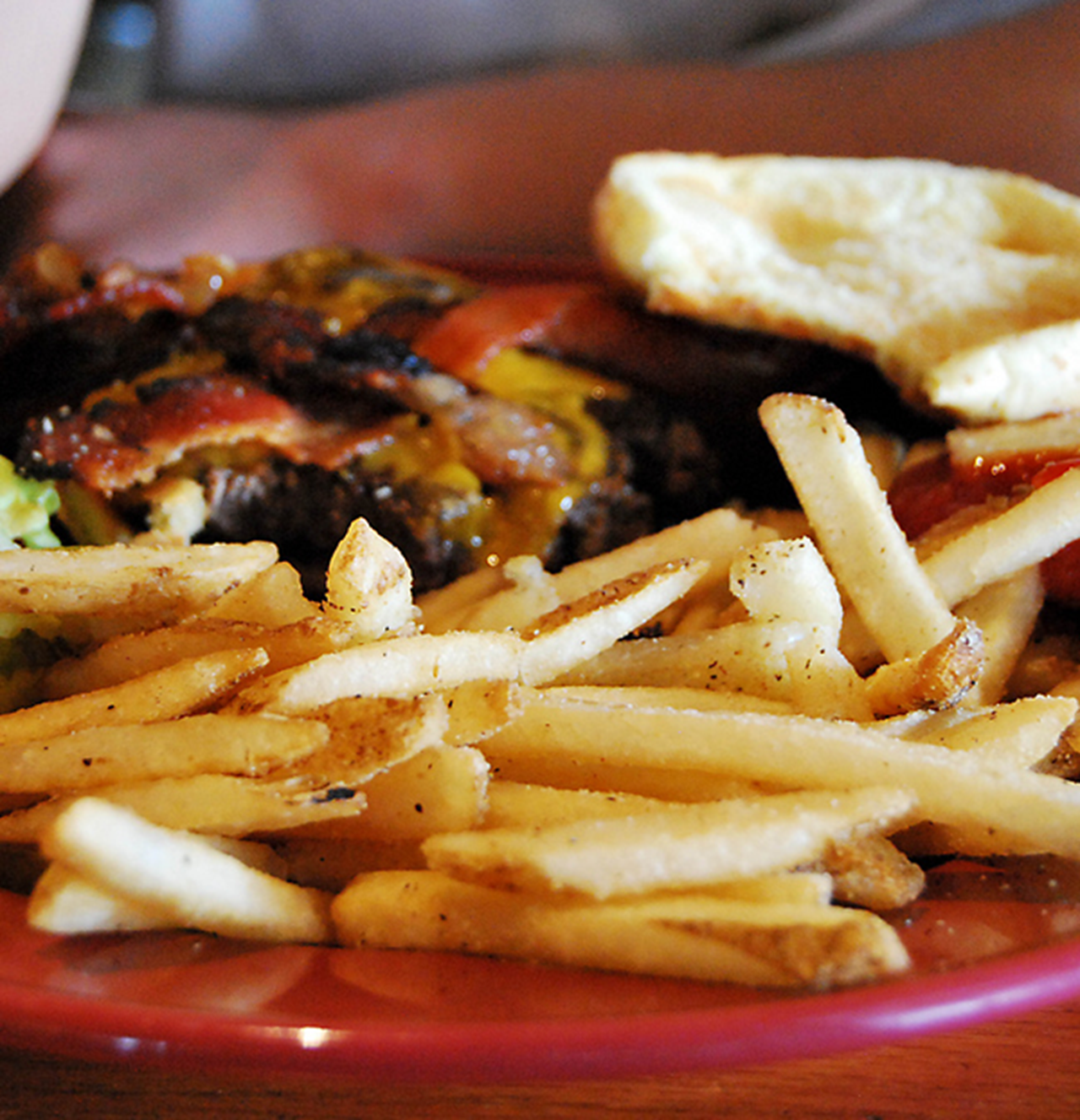Burger and fries served at a restaurant. Credit: xiaozhuli via Flickr