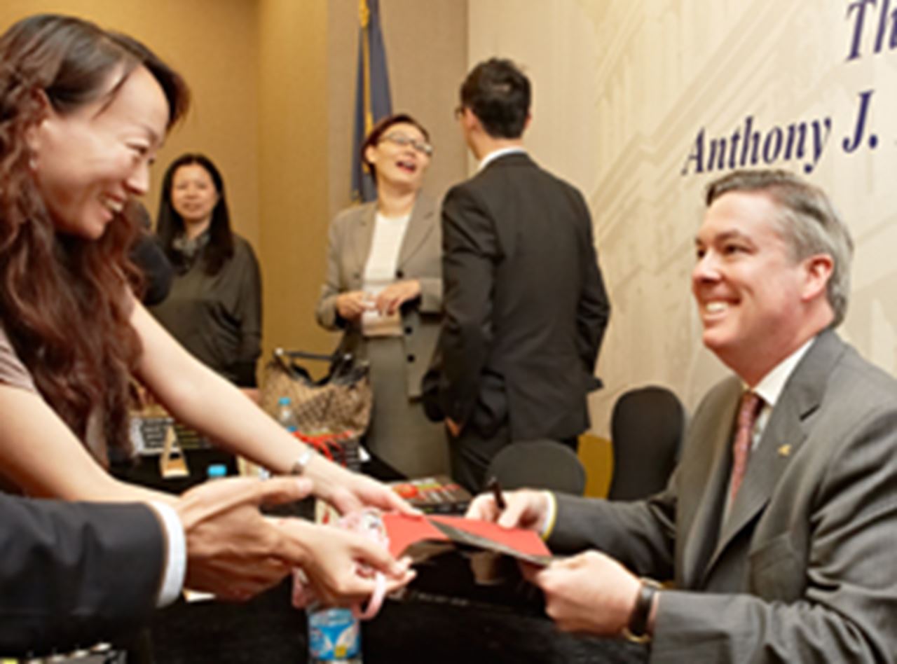 Drexel President Fry greets attendees at the launch of the Anthony J. Drexel book.