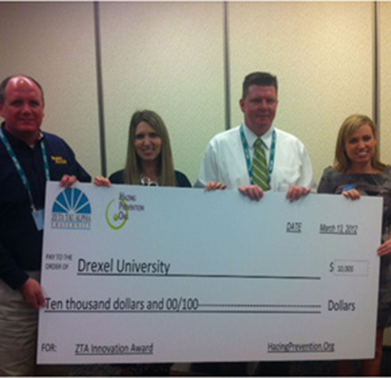 Drexel representatives inlcuding Drexel Dean of Student David A. Ruth accept the $10,000 grant from the Zeta Tau Alpha Foundation.