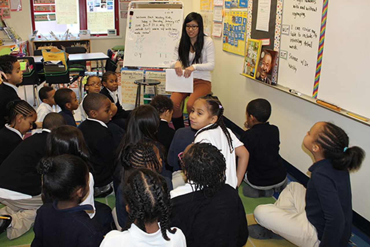 Selena Lin with elementary students