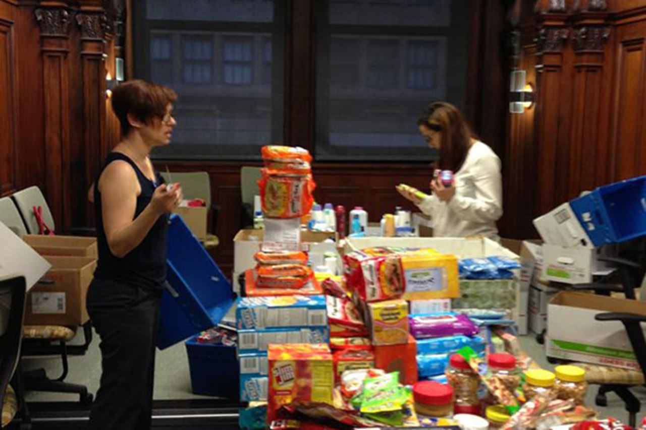 Volunteers assembling care packages
