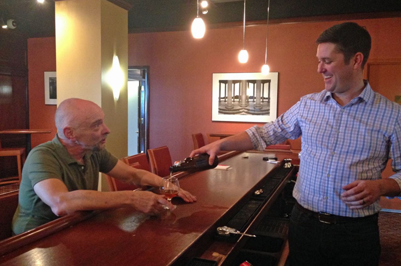 Paul O'Neill, director of special projects for Drexel's Center for Hospitality and Sport Management, pours a beer for Lynn Hoffman, PhD, who teaches "Fundamentals of Beer."