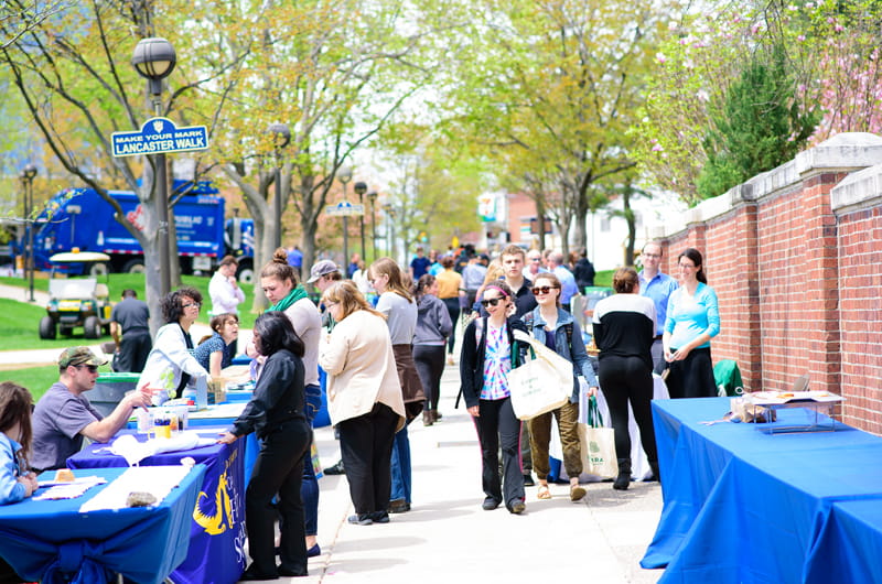 The row of organizations on Lancaster Walk for Drexel's Earth Day Block Party. Photo courtesy of Hanbit Kwon Photography.