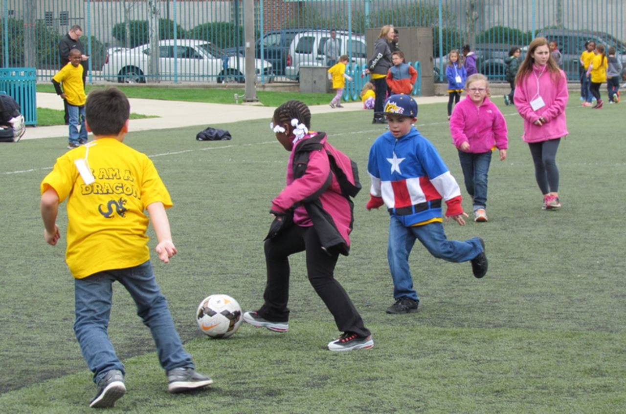 Kids playing soccer during Inspire a Child to Dream Day at Drexel.