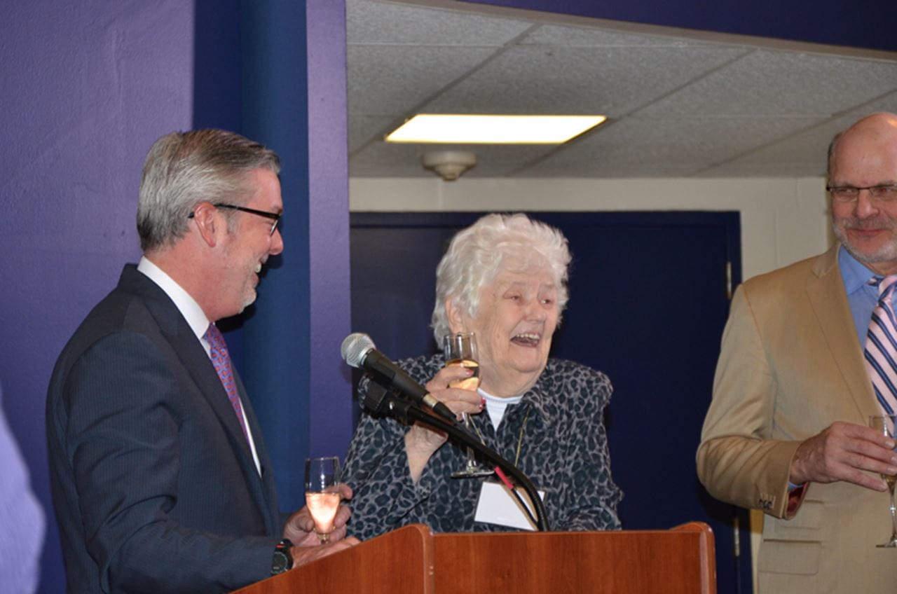 Semanik sharing a toast with Drexel President John A. Fry, left, and Eric Zillmer, right, current director of athletics at Drexel.