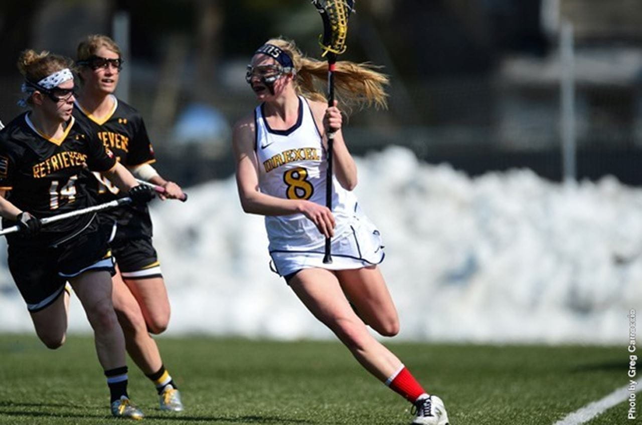 Joelle Hartke carrying the ball. Photo by Greg Carroccio.