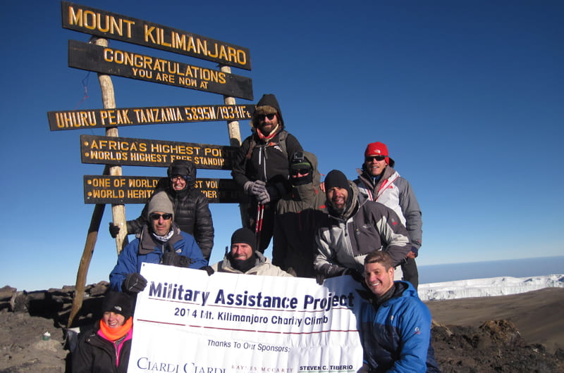 Chris Diaz, in the black hat on the right, with the Military Assistance Project climbing team on top of Mount Kilimanjaro.