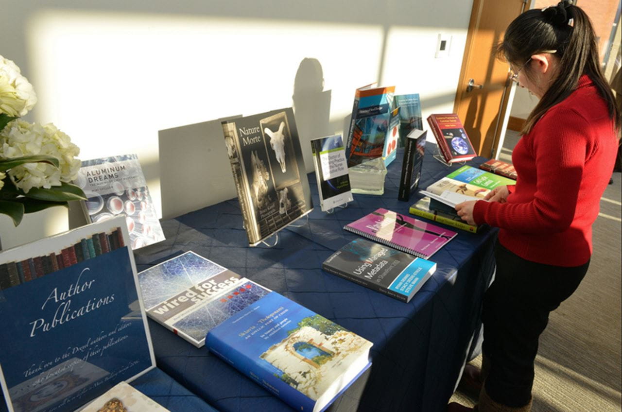 A table featuring some of the works of those who were honored. By Jaci Downs Photography.