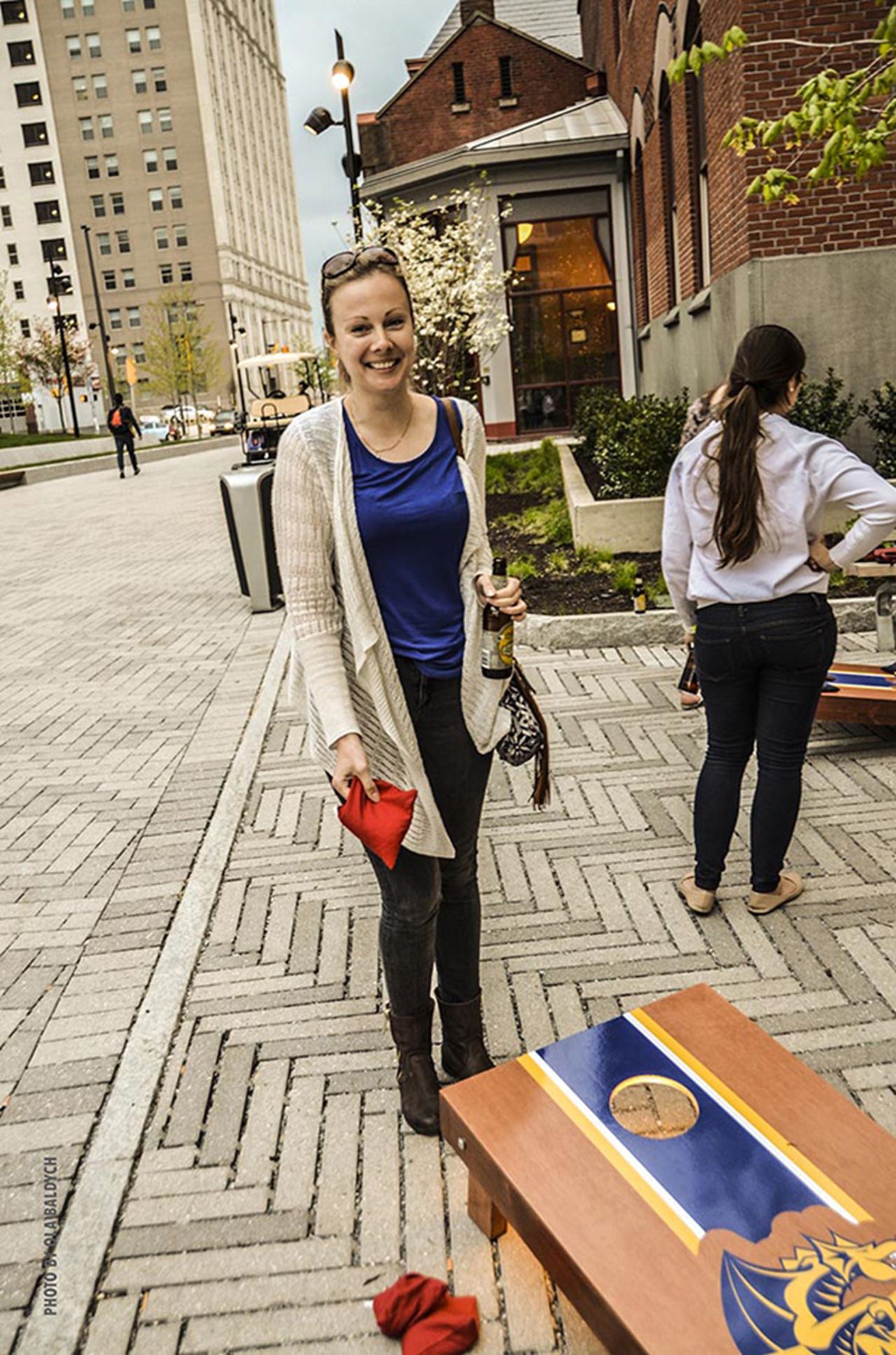 Playing bean bags during the Alumni Weekend Night Market. Photo by Ola Baldych.