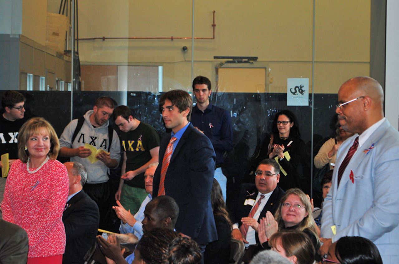 Those honored with the "My Boss is a Patriot Award" standing during the Memorial Day Primer. From left, Susan Aldridge, PhD, Michael Harrington and Lamont Wilson.