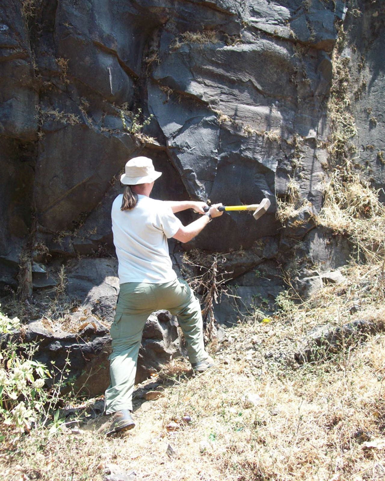 Loyc Vanderkluysen collecting a sample for dating.