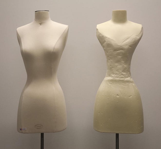 On the left, a contemporary mannequin. On the right, a mannequin after hours of work to modify it to fit one of the older garments from the Robert and Penny Fox Costume Collection. Photo by Michael J. Shepherd.