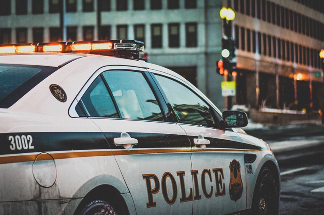 A police car at an intersection