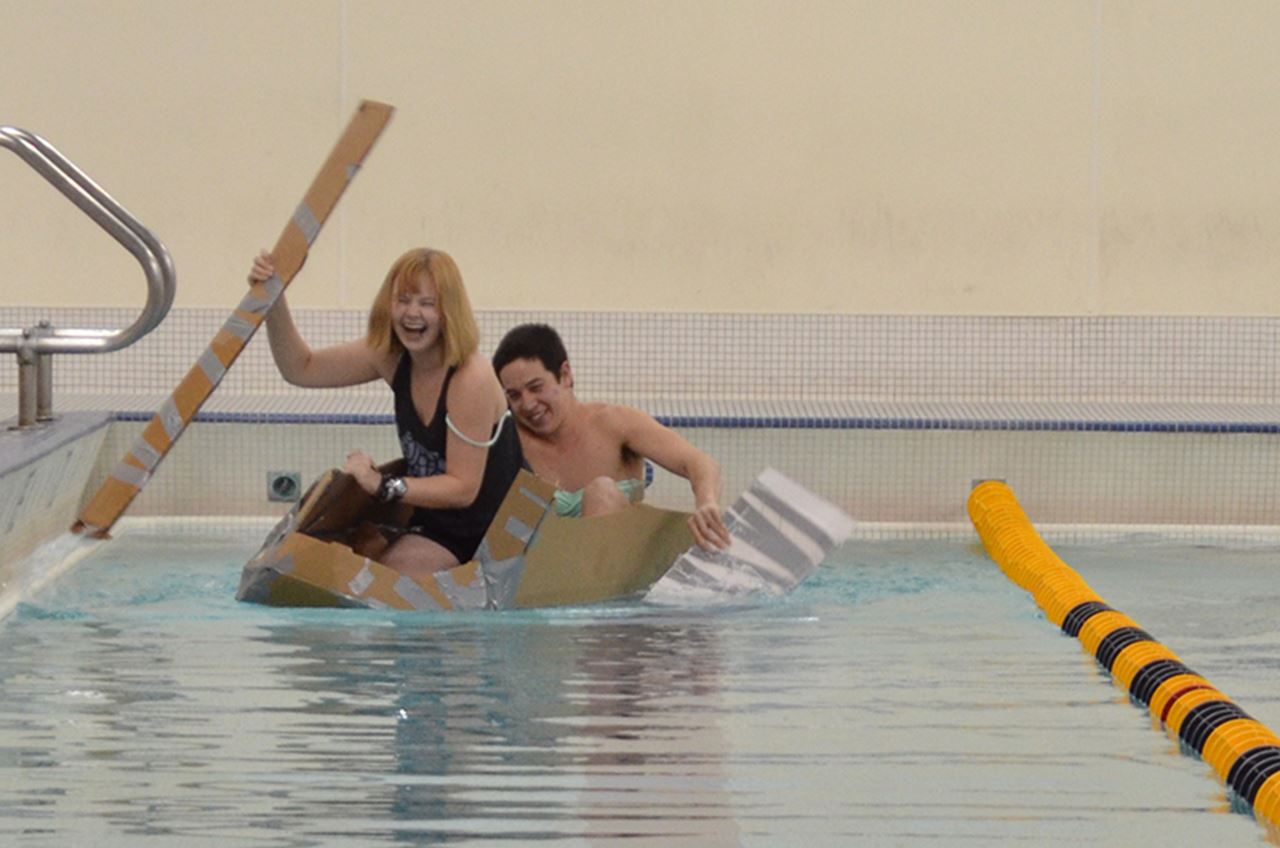 Samantha Haines and Riki McDaniel in their cardboard boat, the Tofu Eater