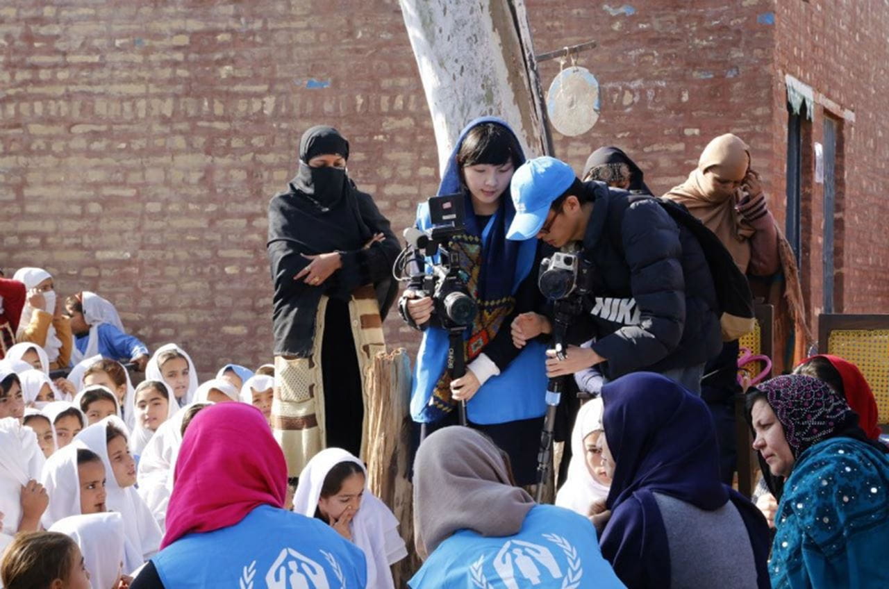 Lili Mao shoots film for a documentary in Pakistan.