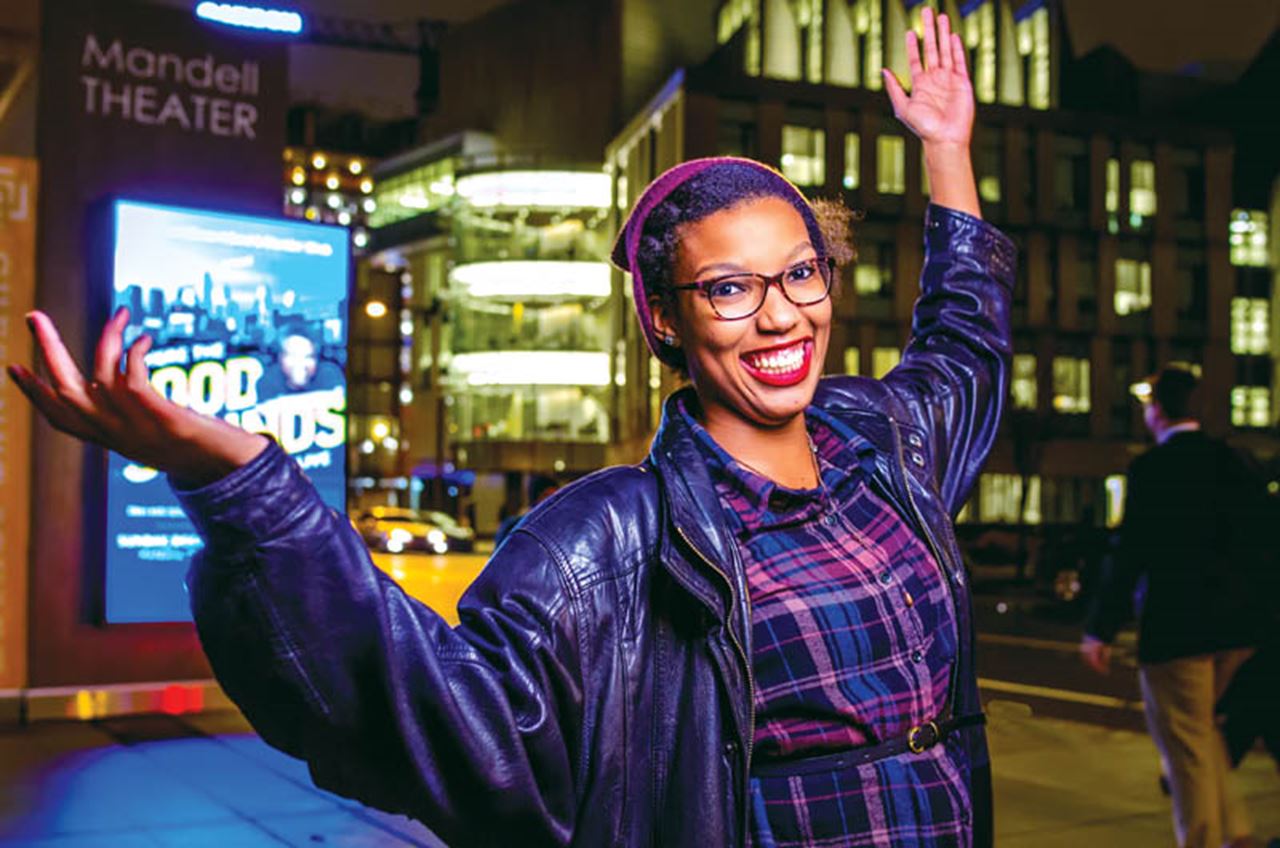 Laurelle Holley, a senior sport management major, stands outside the Mandell Theater.