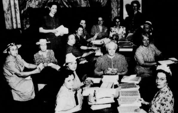 An image of the Drexel Women's Club from the Jan. 12, 1945 issue of Drexel's independent student newspaper, "The Triangle." The original caption reads, "Drexel Women's Club Preparing News Letter for Mailing."