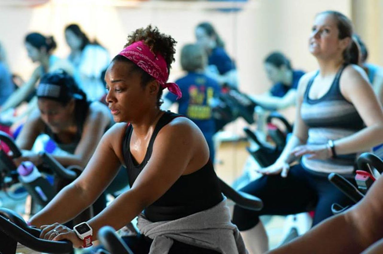 Participants in last year's Indoor Triathlon race to the finish line