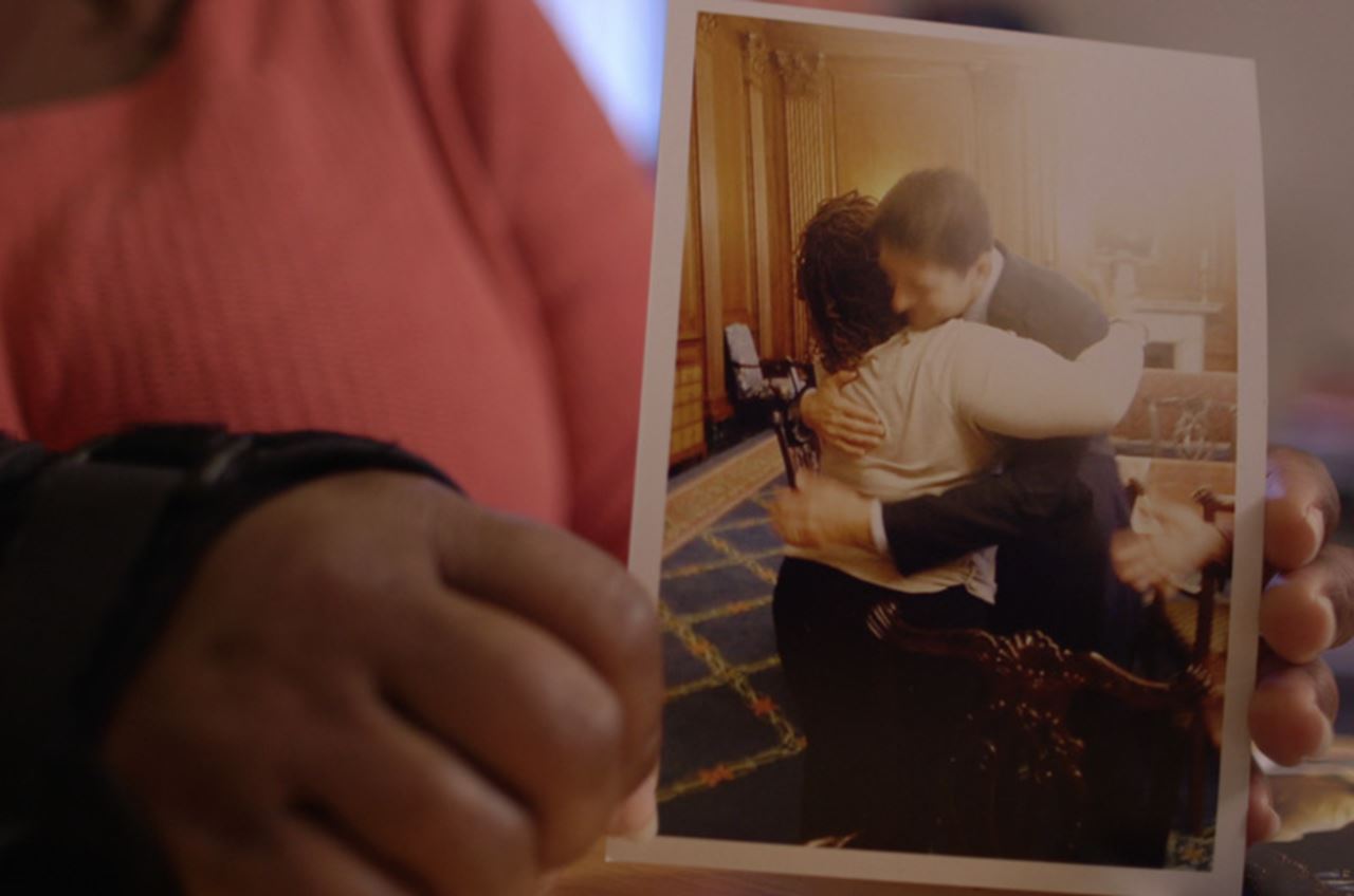 Tianna Gaines-Turner holds a photo of the hug she shared with Congressman Paul Ryan. Photo by Jas Borman.