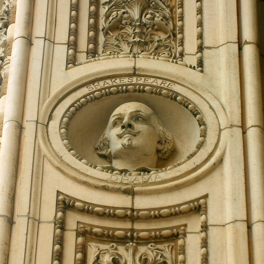 Bust of William Shakespeare, representing drama, on the archway of Main Building.