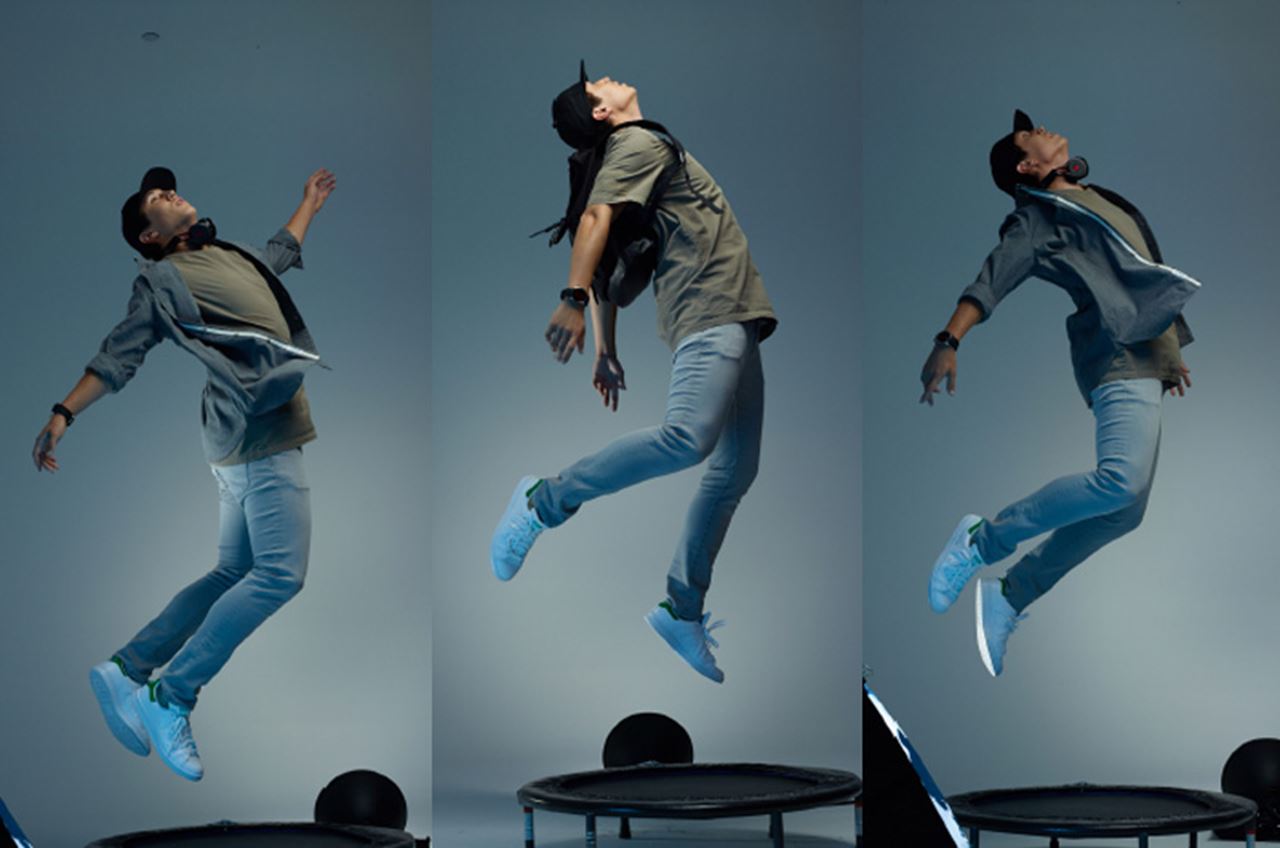 A behind-the-scenes shot of Jonathan Cedrone '15 jumping on a trampoline for a photo to be used in the "Ambition Can't Wait" campaign.