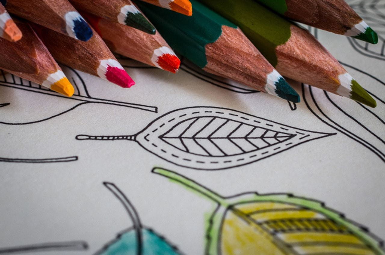 Colored pencils and a half-colored-in image.