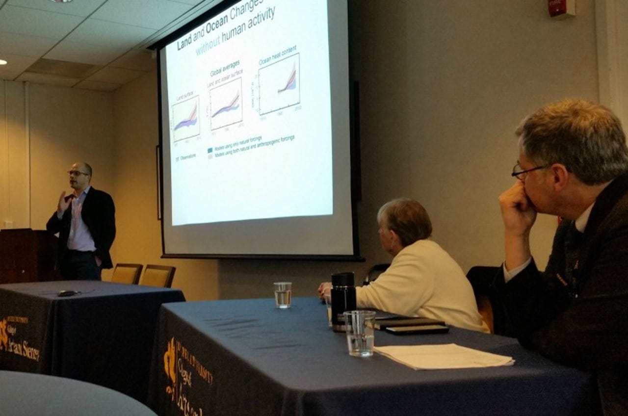Peter DeCarlo, PhD, speaks about climate change at a panel discussion.