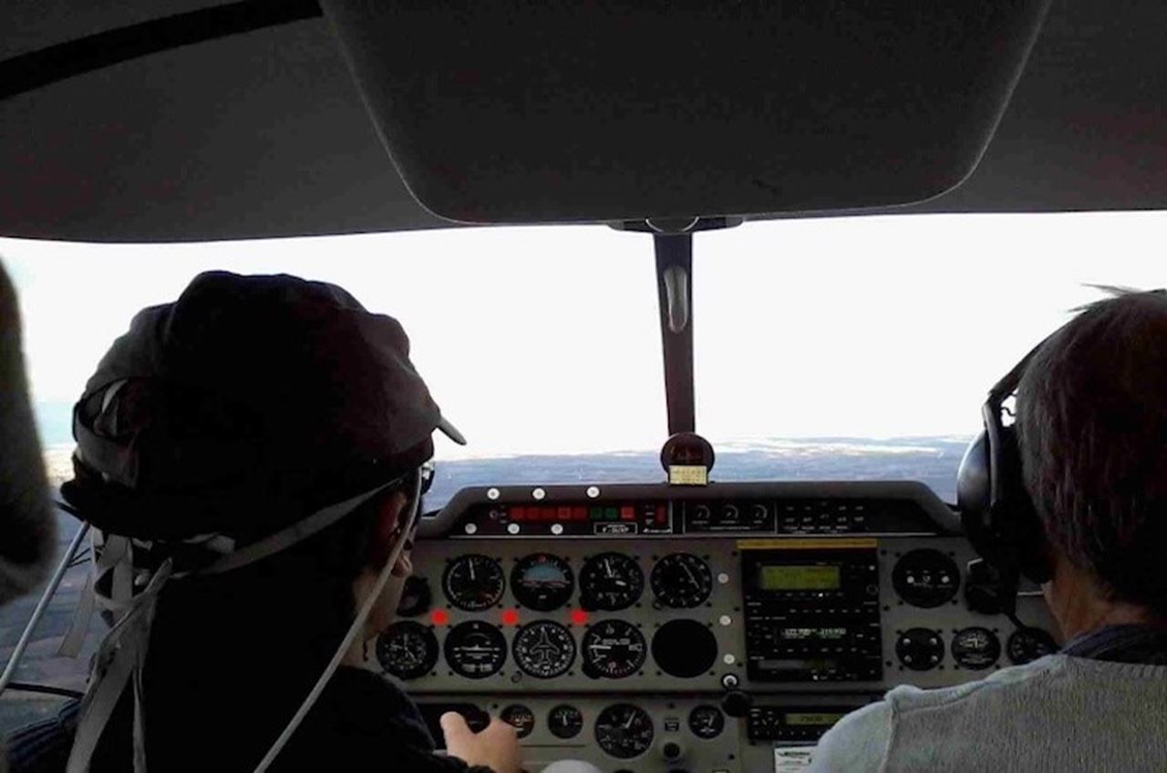A pilot study subject wears a wireless fNIRS headband while researchers on the ground measure his cognitive workload. (Credit: ISAE-SUPAERO)