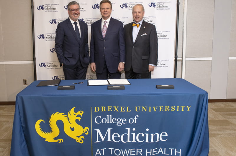 Photo of Drexel President John Fry, Tower Health President and CEO Clint Matthews and Dean of Drexel's College of Medicine Daniel Schidlow at the signing ceremony