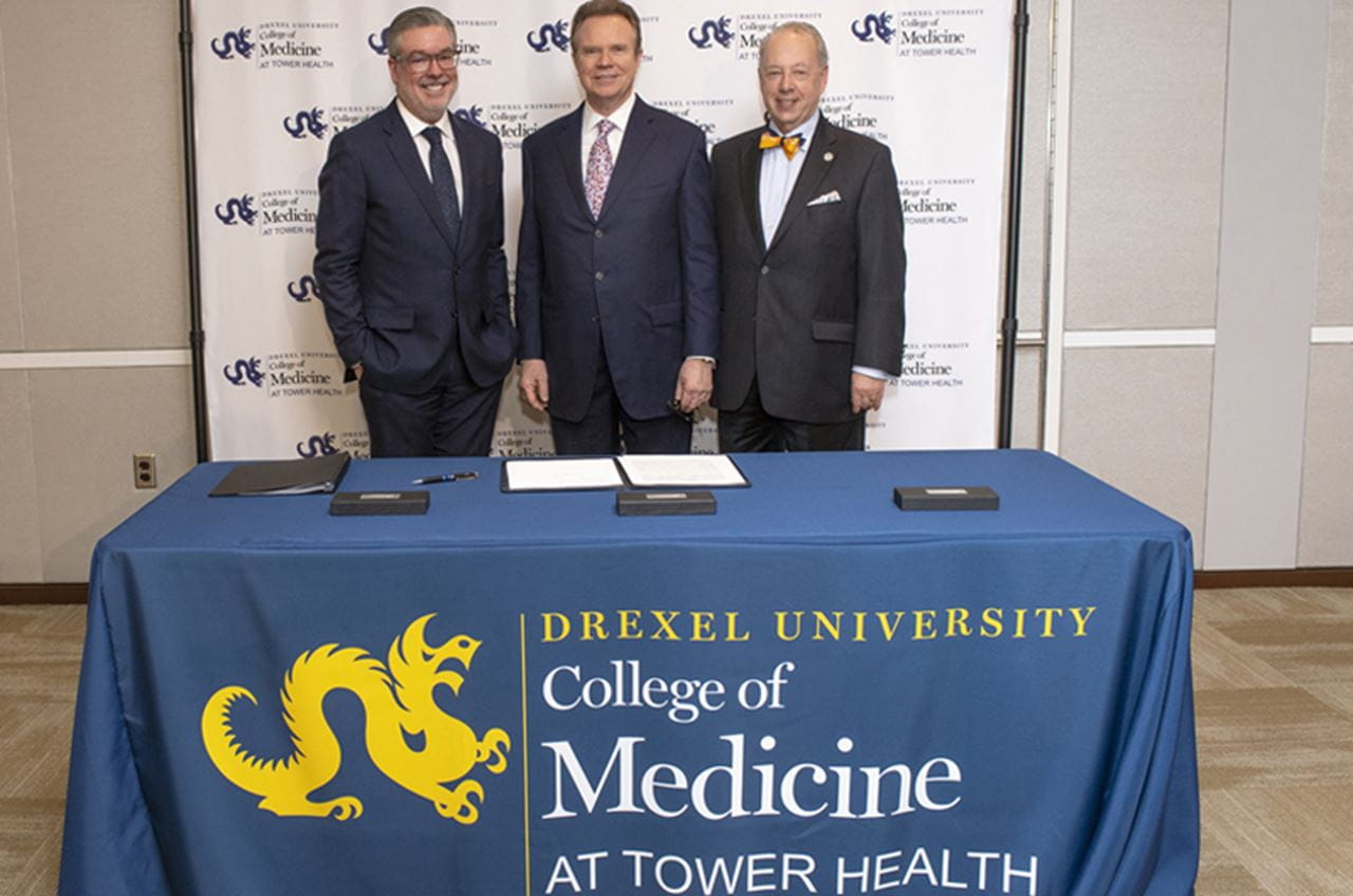 Photo of Drexel President John Fry, Tower Health President and CEO Clint Matthews and Dean of Drexel's College of Medicine Daniel Schidlow at the signing ceremony