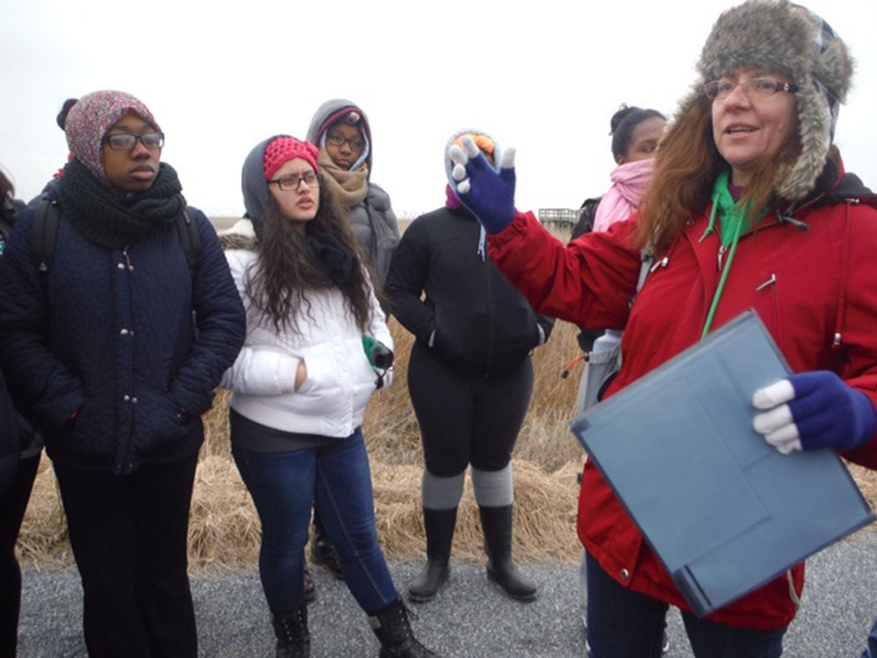 Payne with a group of participants in the WINS program on site.