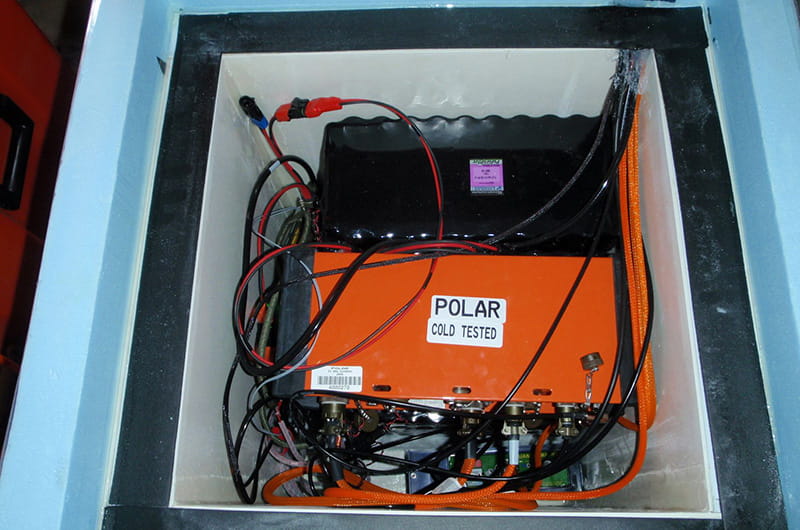 An orange sensor inside of a box