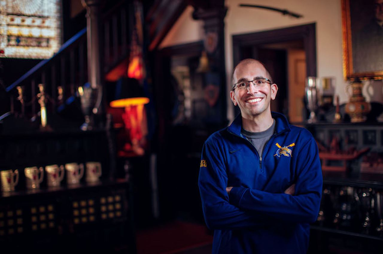 David Florio '06 is surrounded by rowing history in the Button, where he has lived as the caretaker for five years. Photos by Charles Shan Cerrone.