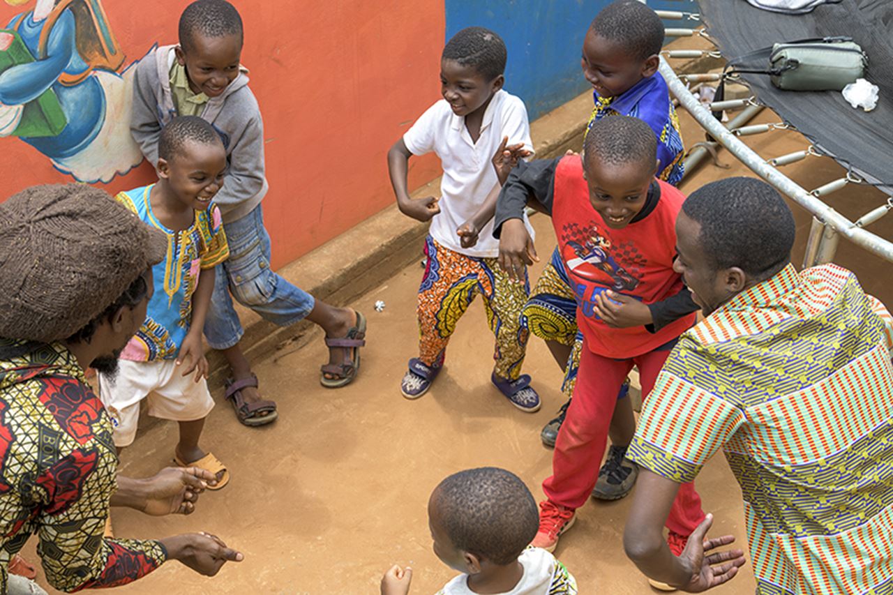 Workshop participants engage Bitamie Lucia International School students in dance and story-telling.