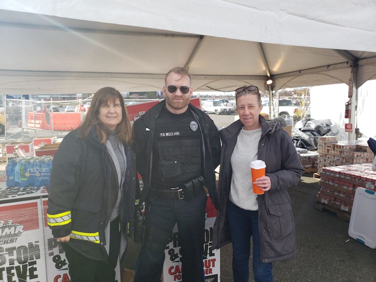 Drexel Public Safety’s Madonna Calderoni, Police Officer Logan Wells, and Linda Moran drop off donations for Preston & Steve’s Camp Out for Hunger.