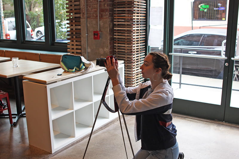 Brandel setting up a camera for an interview for her KatsKrave blog. Photo credit: Kris Tookes.