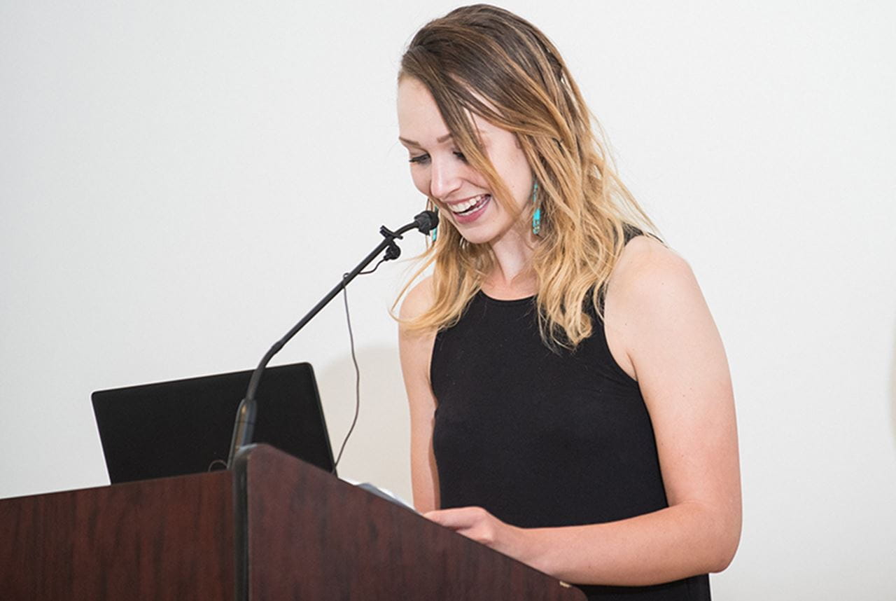 Alex Will-Cole, a PhD candidate in materials science and engineering in the College of Engineering and the outgoing GSA president, presenting at the 2019 Graduate Student Day awards.