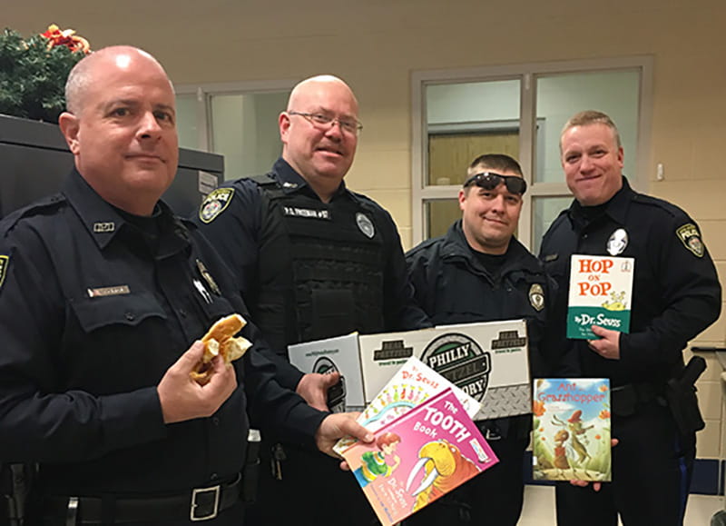 Drexel police officers who visited the Frances E. Willard School to participate in Read Across America.