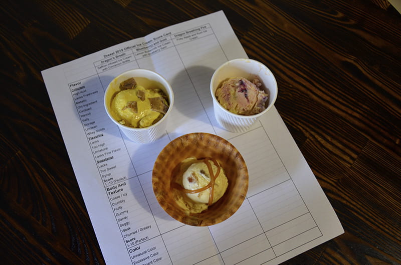 The student-designed ice cream and the rubric used to grade them. From left to right: "Dragon's Breath," "Fire Breathing Dragon" (in waffle bowl) and "Blue(berry) and Gold."