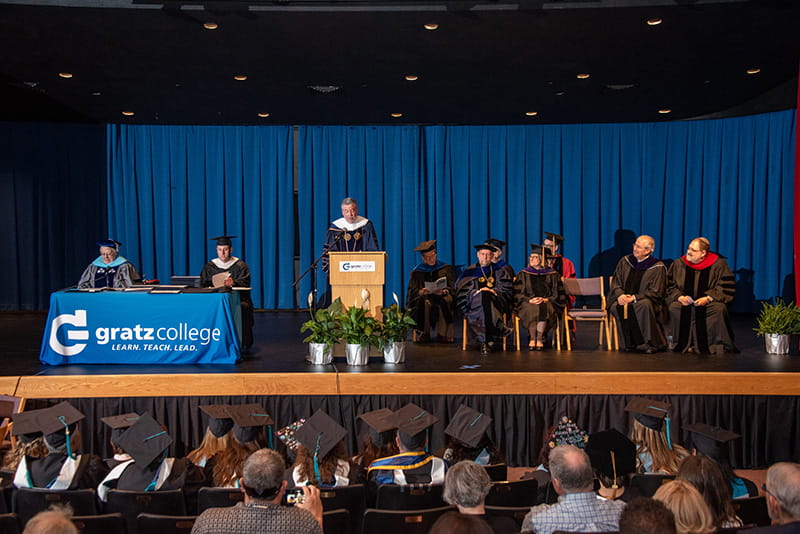Drexel University President John Fry addresses graduates at the 2019 Gratz College commencement ceremony.