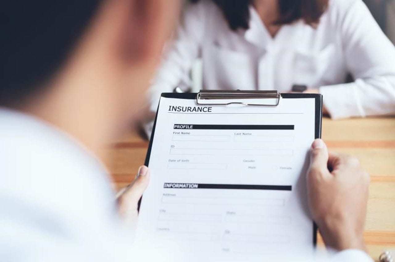 Man fills out insurance information