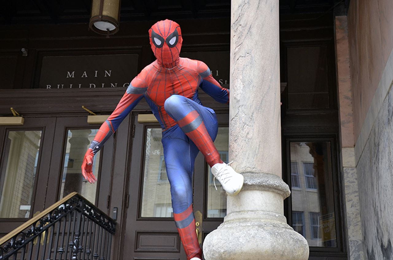 Drexel Spidey poses outside of the Main Building on Drexel's University City Campus.