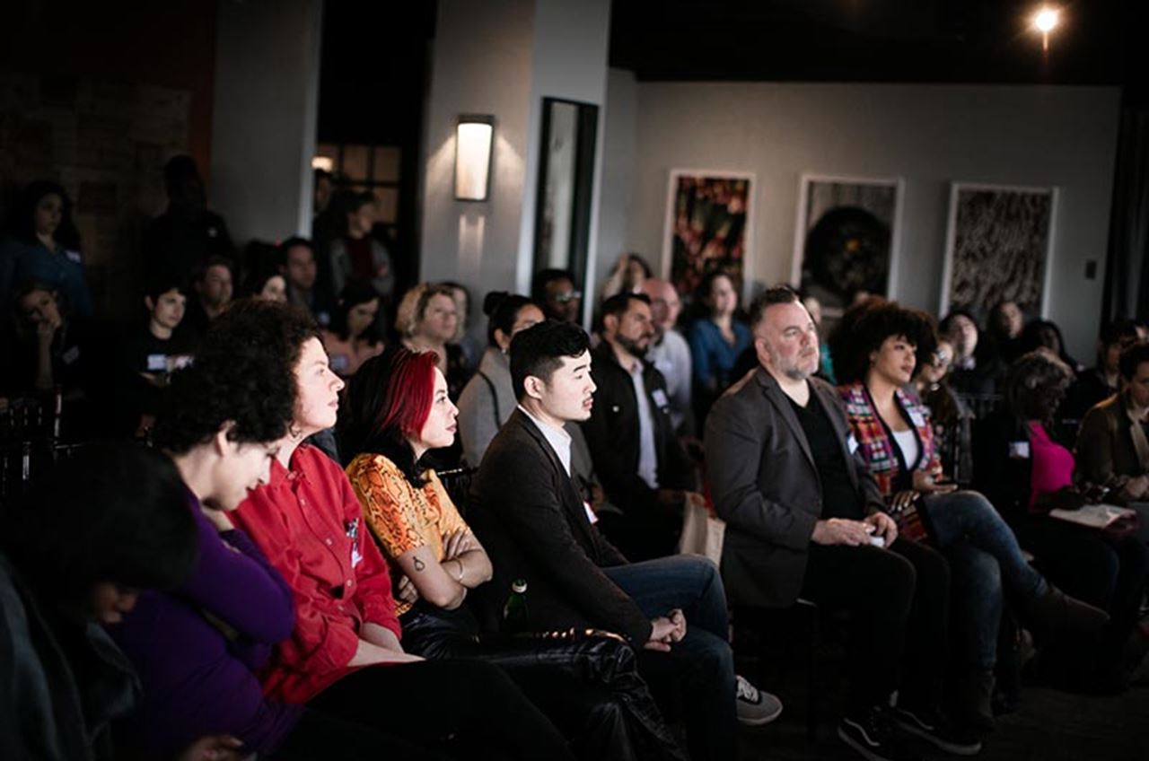 Philly Chef Conference attendees sitting in a crowd watching a presentation