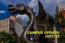 Dragon statue with text: campus update, July 22