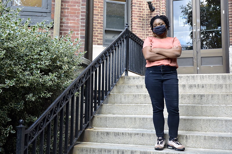 Drexel student activist Tianna Williams posing outside of the Rush Building, which will soon be the home of the University's Center for Black Culture.