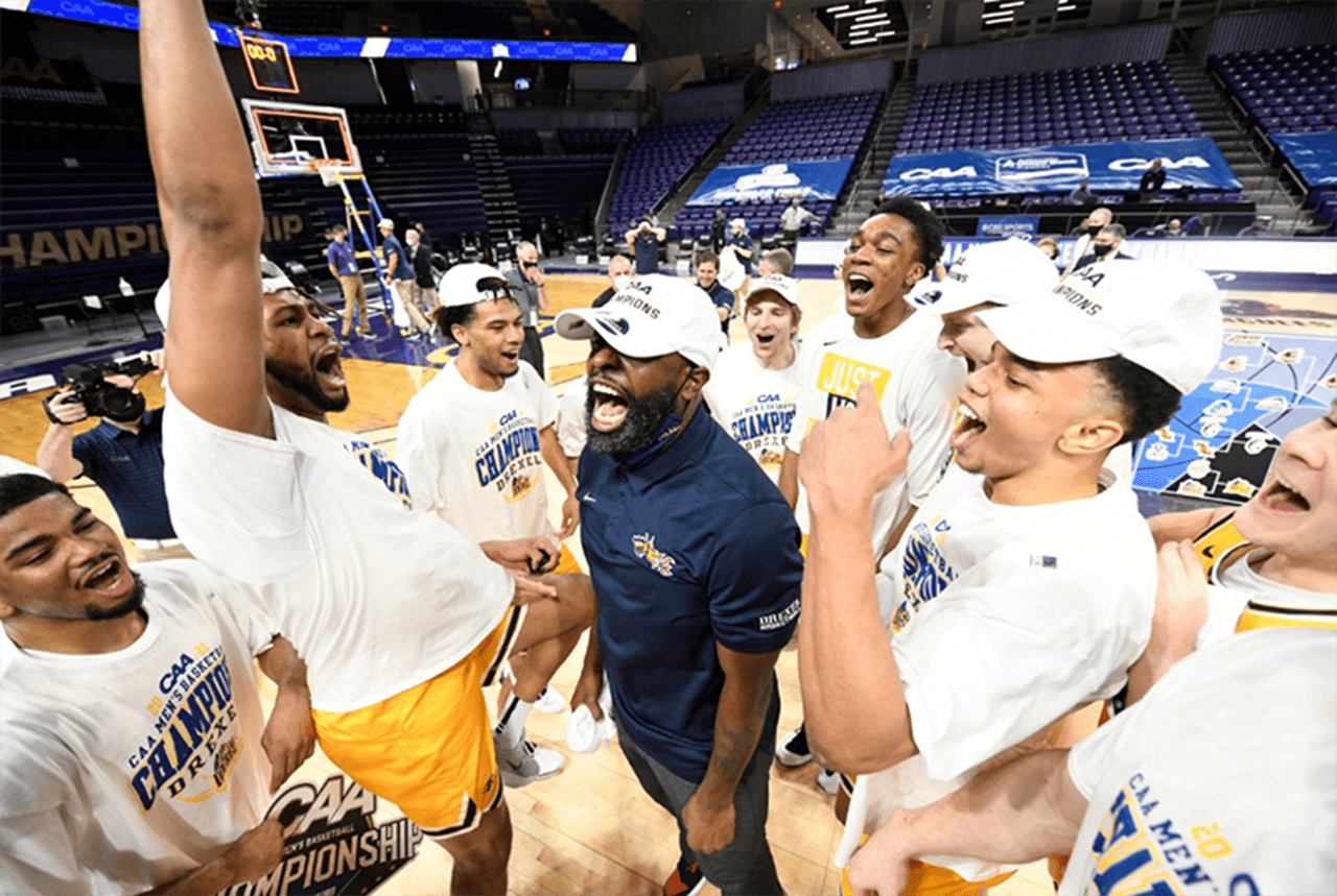 The men's basketball team celebrating their championship win.