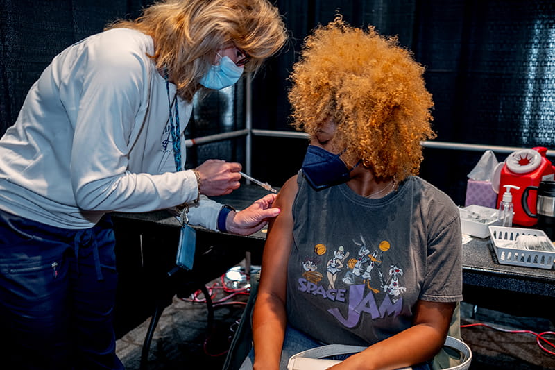 Nia McCune, a second-year entertainment arts management student, receiving the Pfizer vaccine on April 19 at Drexel University.